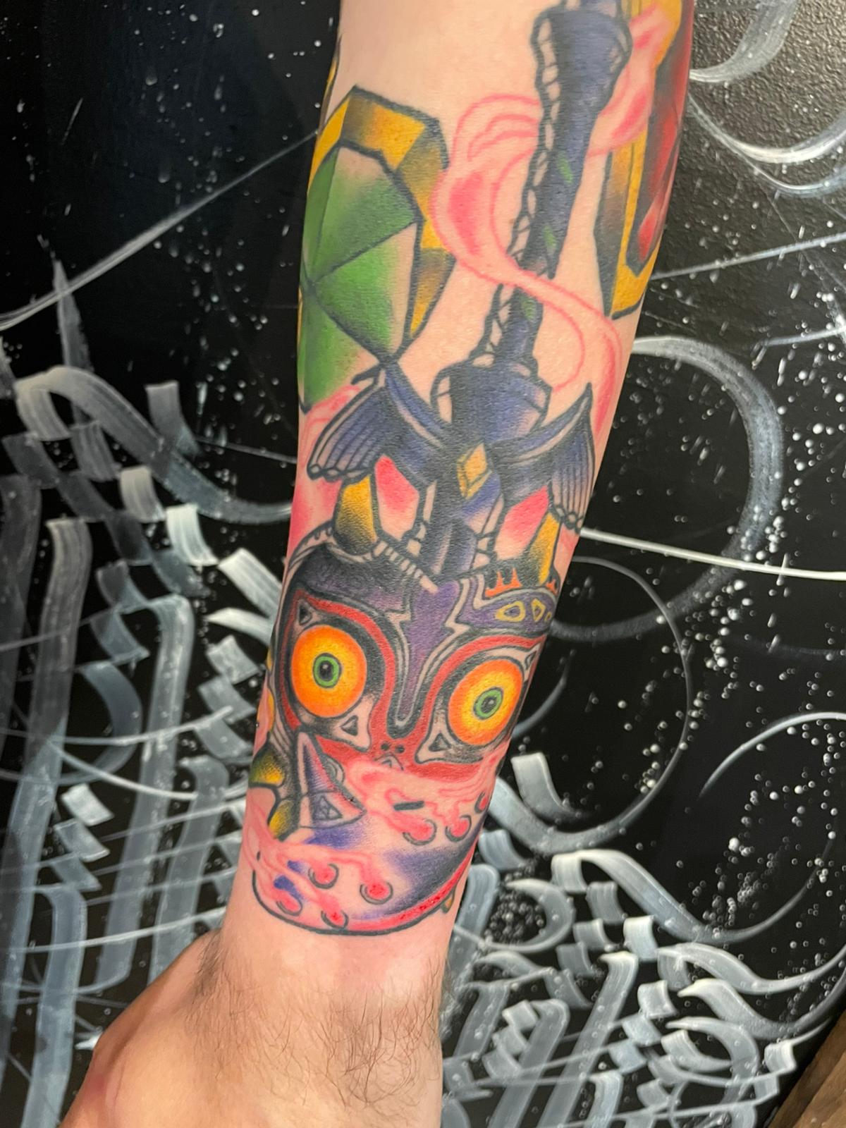 Colour Majora’s Mask sleeve tattoo by Michael Lisney
