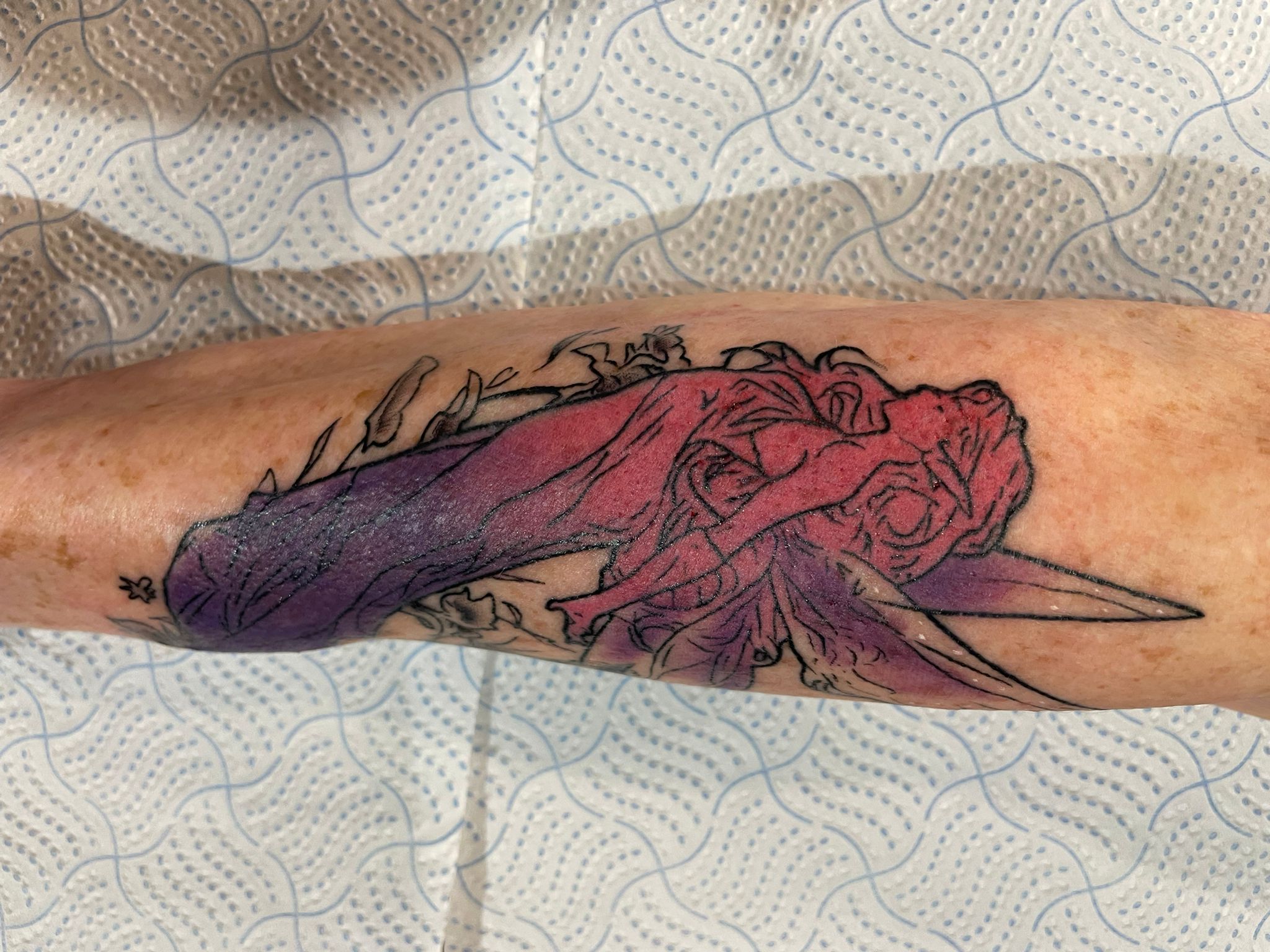 Colour floral tattoo by Michael Lisney